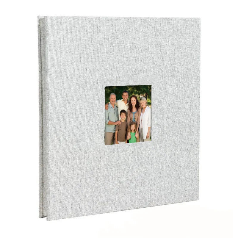A grey linen front scrapbook memory book with a photo of a family.