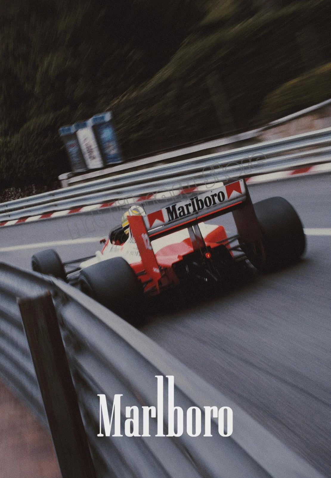A blurred image of a red and white Marlboro Formula 1 car on a track, with the word Marlboro visible in the foreground.