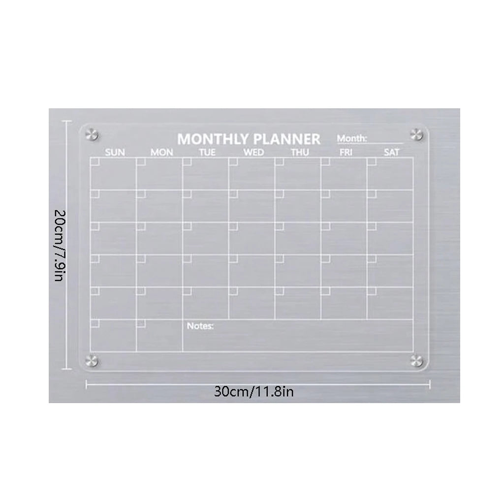 A monthly planner grid on a magnetic acrylic board with labeled days and space for notes.