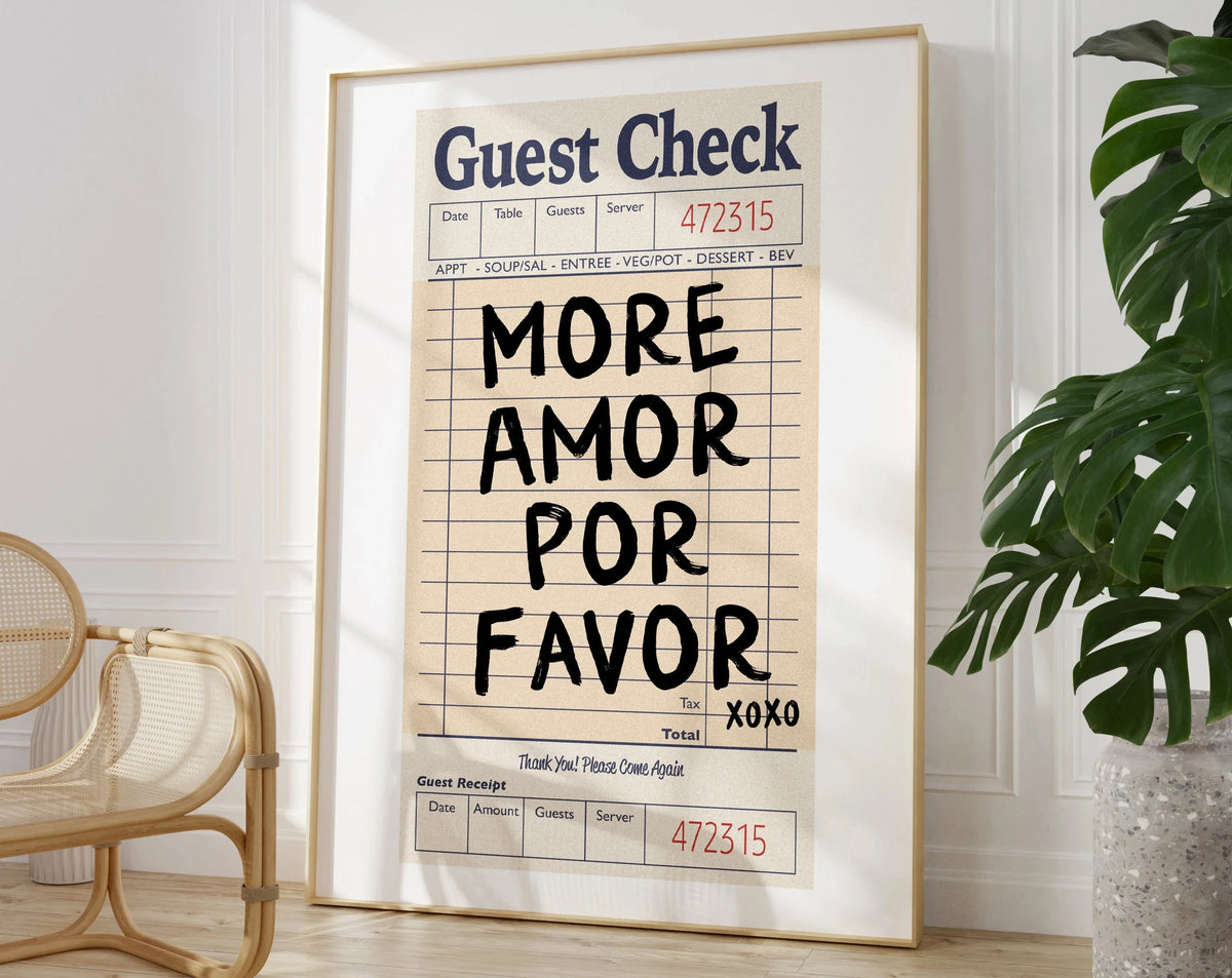 A framed piece of wall art featuring a handwritten guest check form with the text More Amor Por Favor on it.