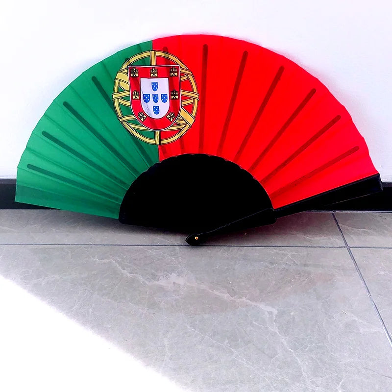 A folding fan featuring the Portuguese national flag design with red and green sunburst patterns.