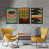 A gallery wall featuring three posters of Radiohead album art in various color schemes and layouts.