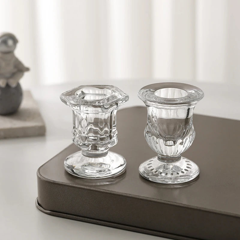 Elegant Nordic glass candle holder with a clear glass candlestick resting on a dark gray rectangular tray.