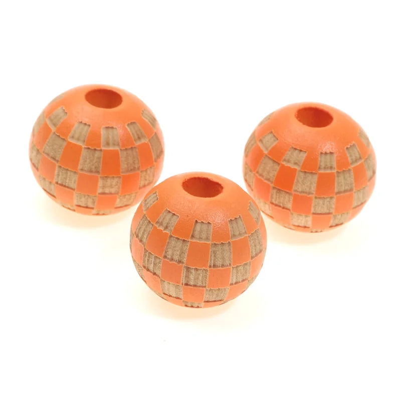 Three natural wooden checkered beads for jewelry making, round and orange-brown.
