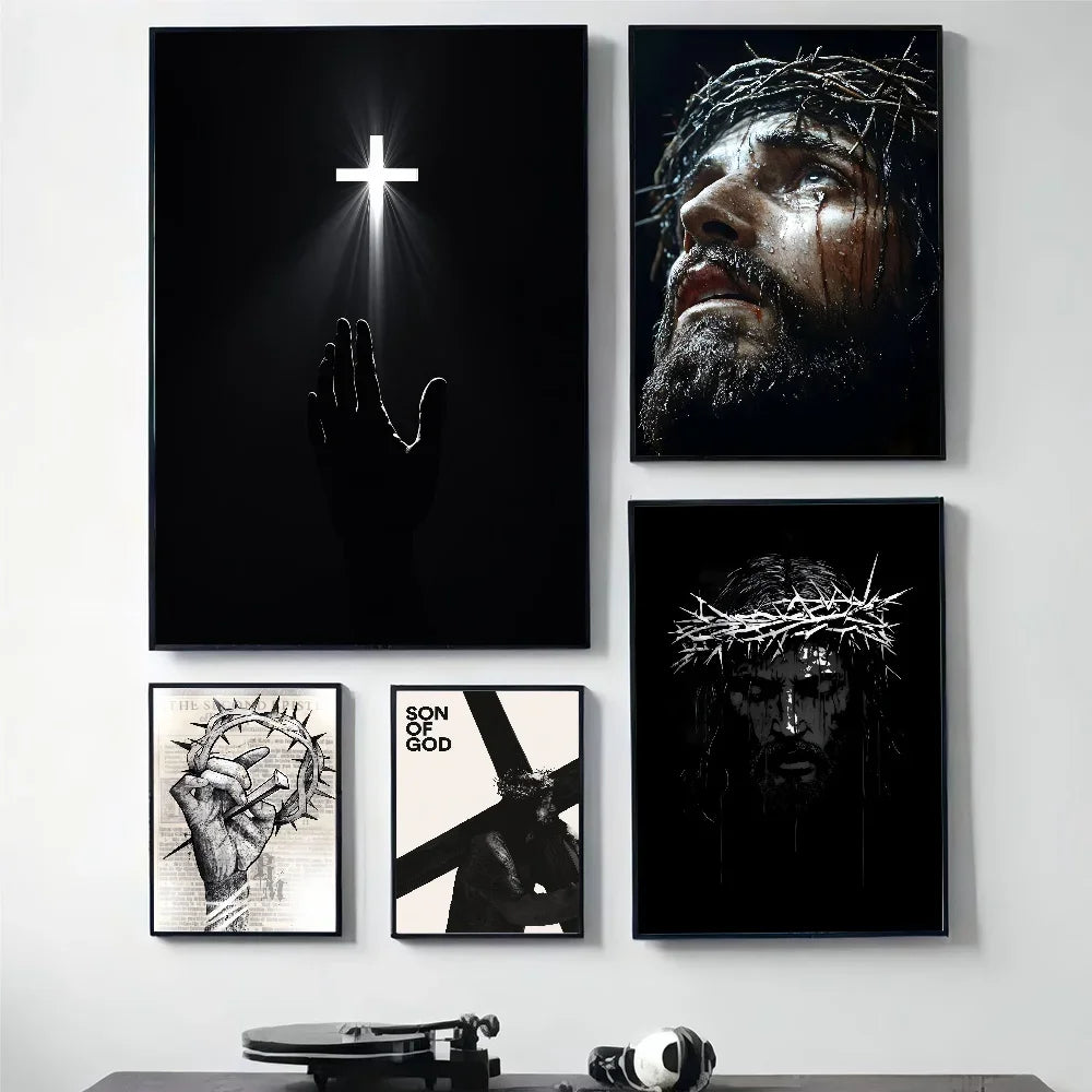 A set of four black framed canvas prints featuring abstract art and a cross design.