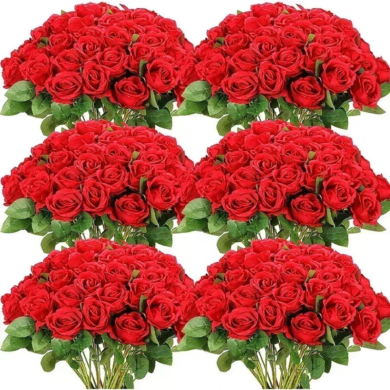 A bouquet of artificial silk red roses arranged for table decor.