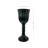 A tall, dark green or black glass cylinder flower vase with a narrow neck and a flared base.
