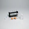 A miniature laboratory set featuring glass tubes, a rack, and small amber-colored objects on a gray surface.