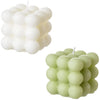 A set of two white and pink cube soy wax candles