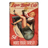Vintage rusty cola metal wall sign featuring a woman and text promoting Atom Bomb Cola