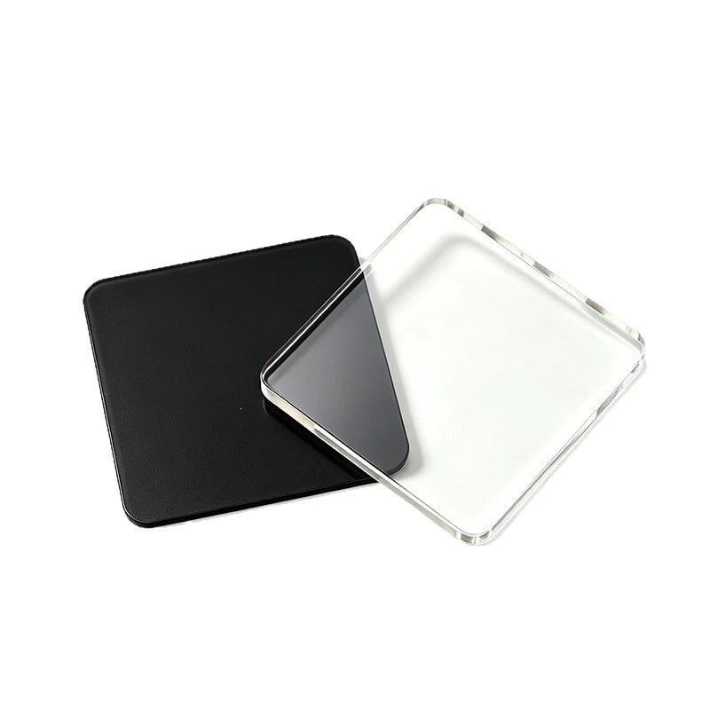 A black acrylic magnet with a clear, square piece of white acrylic on top.
