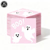 A stack of pink ghost Halloween party tableware featuring white ghosts and the word BOO!