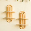 Two wooden geometric wall shelves with vertical slats mounted on a light-colored wall.