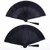 Black traditional Chinese folding fan with a decorative tassel