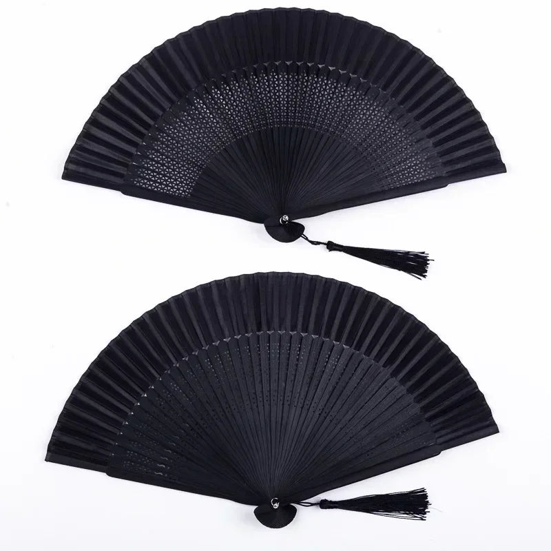 Black traditional Chinese folding fan with a decorative tassel