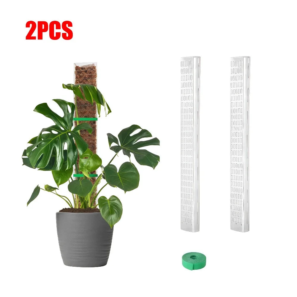 Two plastic moss pole plant supports with a green plant and a small green piece