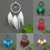 Handmade feather dreamcatchers in various colors and styles displayed against a gray background.