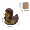 A brown resin figurine of a duck with blue eyes and orange beak, displayed next to its packaging box.