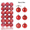 A box containing 36 festive red and rose gold glitter Christmas tree ornament balls.