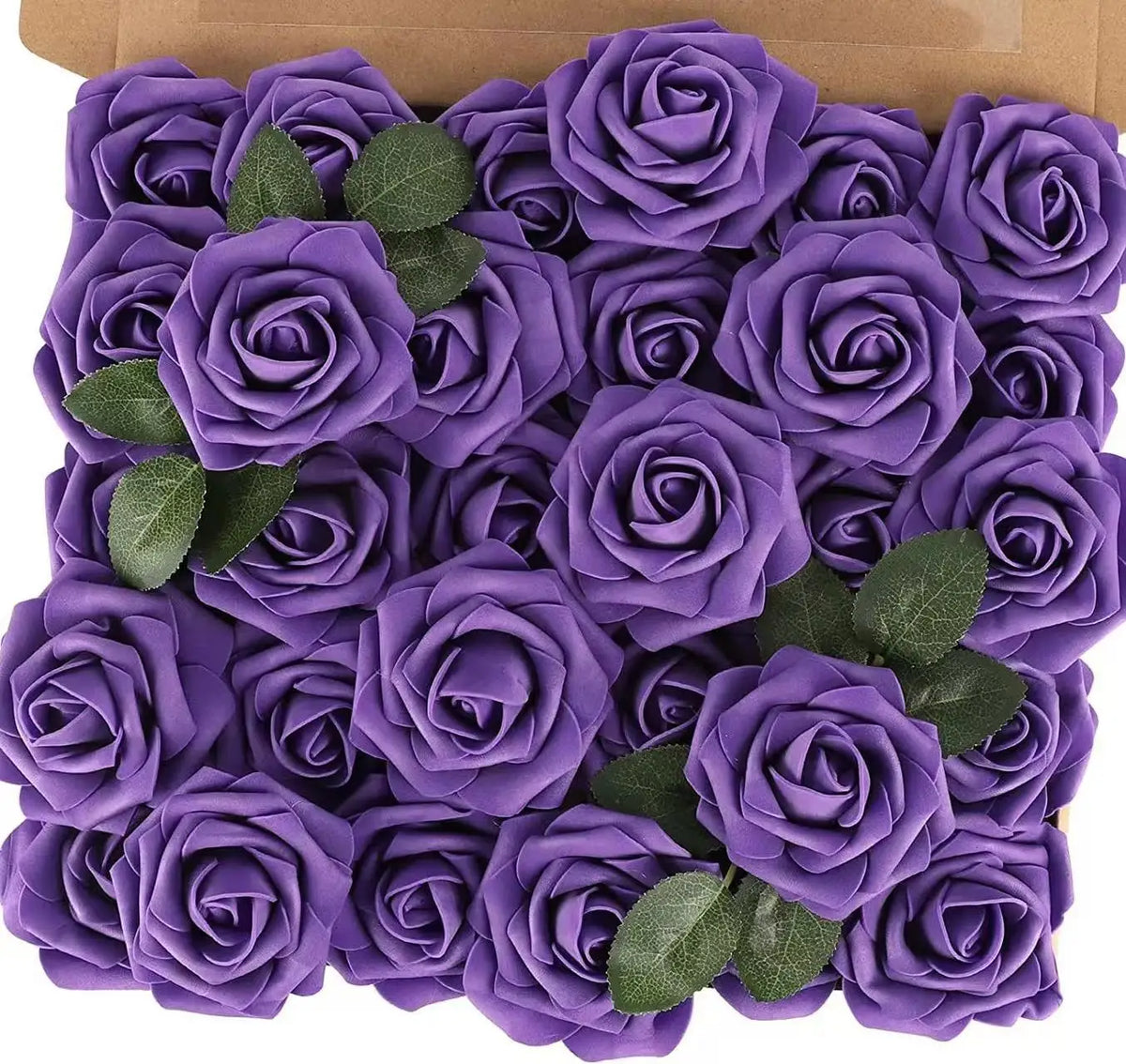 A bouquet of realistic purple foam roses with green leaves in a cardboard box.