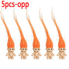 Five orange troll dolls with long orange hair displayed side by side.