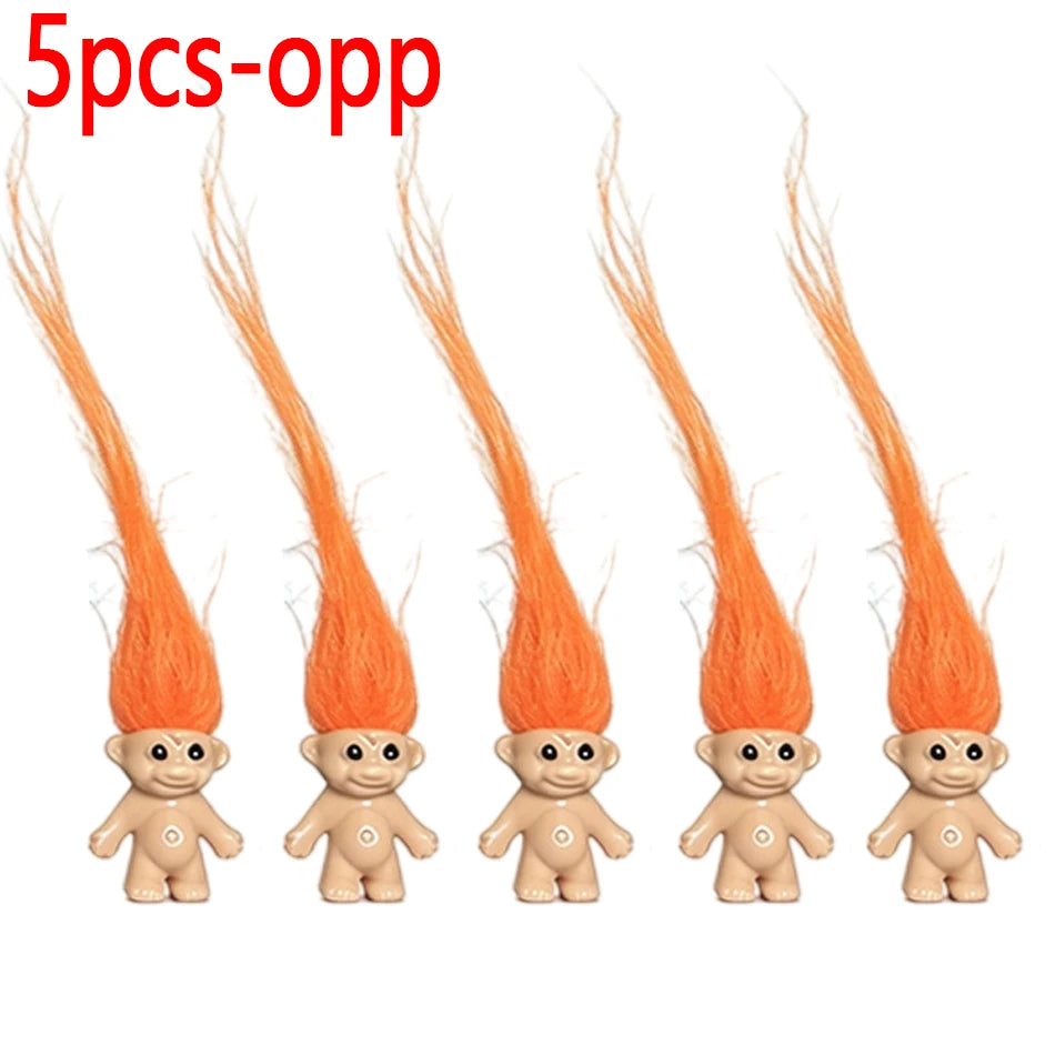 Five orange troll dolls with long orange hair displayed side by side.