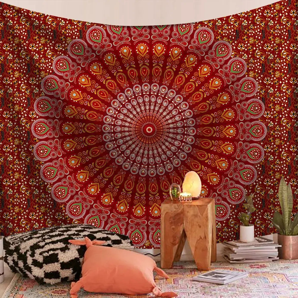 Bohemian mandala tapestry wall art featuring a large, intricate red and orange circular design on a textured wall.