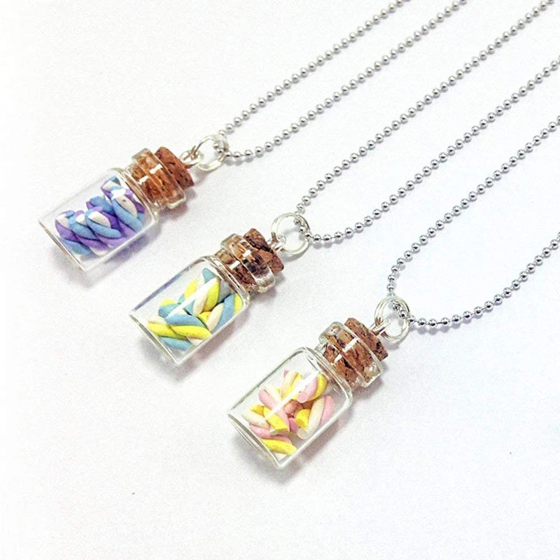 Silver necklaces featuring glass cork stoppers with dried floral inclusions for DIY decor