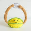 Handmade crochet potato doll with a yellow body and green skin, displayed next to an inspirational card.