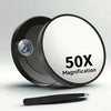 A black magnifying compact mirror with a suction cup is shown, demonstrating 50x magnification.