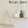 Three beige wooden hanging shelves with hemp rope for floating wall mount plants and decor