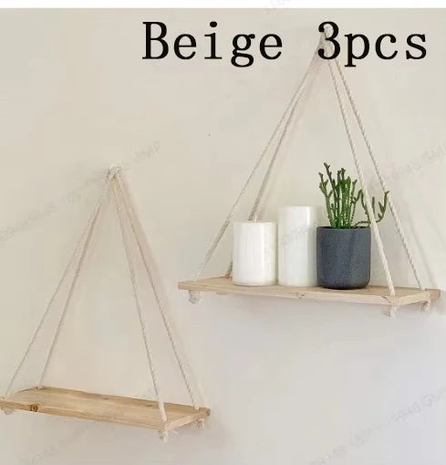 Three beige wooden hanging shelves with hemp rope for floating wall mount plants and decor