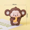 A set of brown animal cake toppers resembling a cute monkey with large ears and a yellow accent.