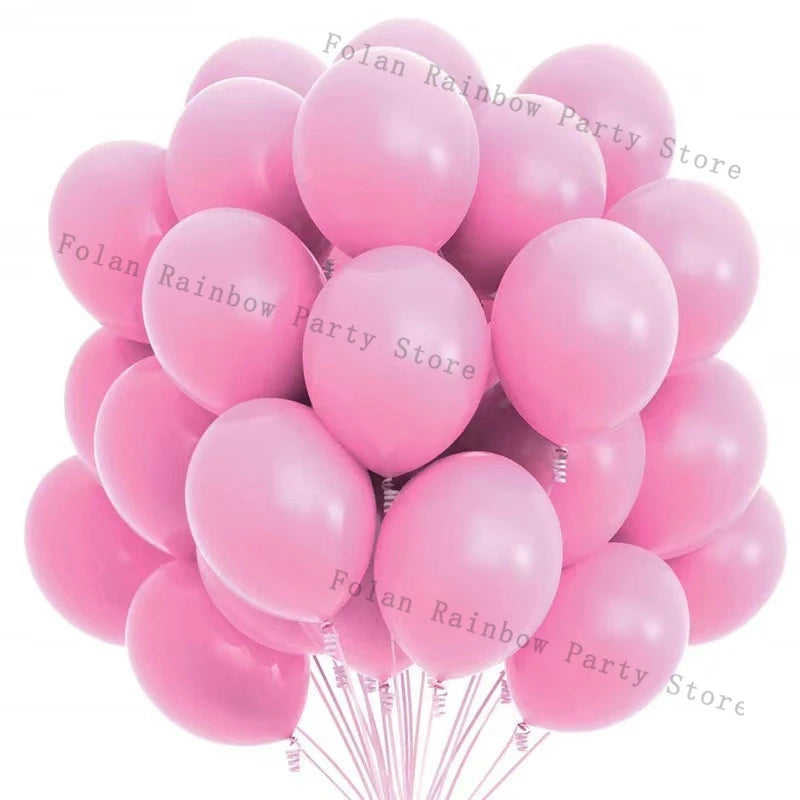 A cluster of matte pink balloons forming a party store garland set.