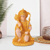 Golden resin statue of Hanuman with a crown and mace, used for meditation and home decor.
