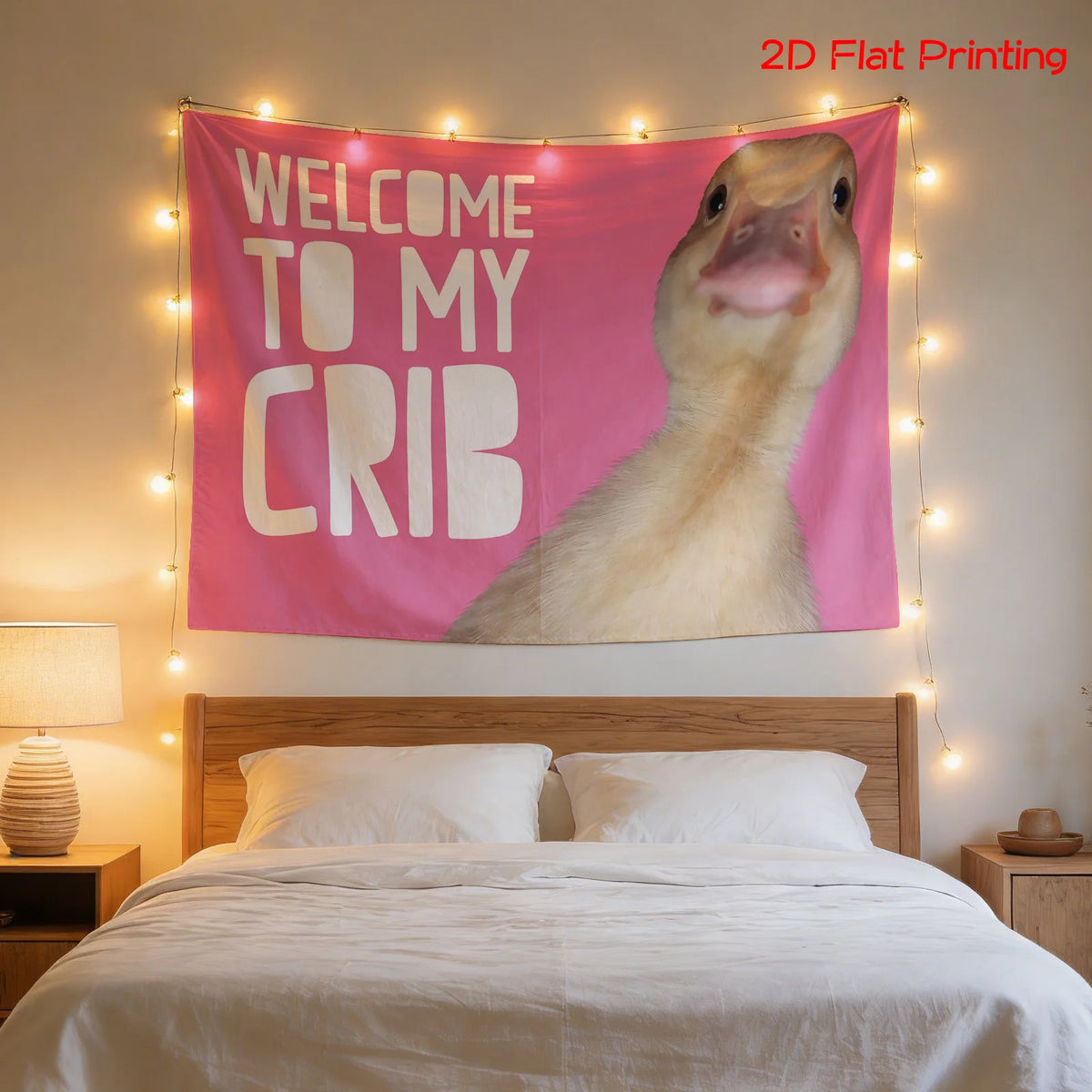 A pink tapestry featuring a duck's head welcoming guests to its crib, displayed above a bed.