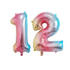 Two foil balloons shaped like the numbers 1 and 2 in pink and rose gold for birthday party decor