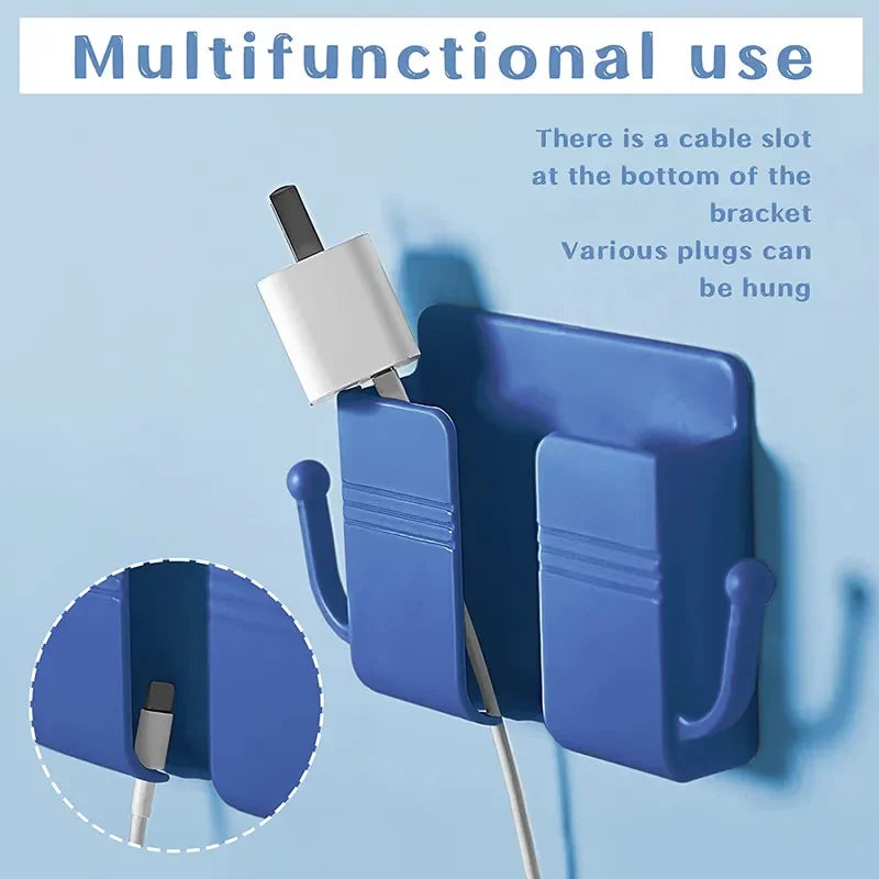 A blue wall-mounted multifunctional organizer with a cable slot for hanging plugs and a phone holder.