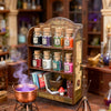 A wooden display box of glitter powder jars with various colors and textures displayed in a rustic shop setting.
