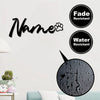 Black personalized metal pet memorial sign with a paw print and fade and water resistant labels on a white wall.