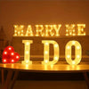 Luminous LED alphabet night light spelling out MARRY ME I DO with warm glowing letters
