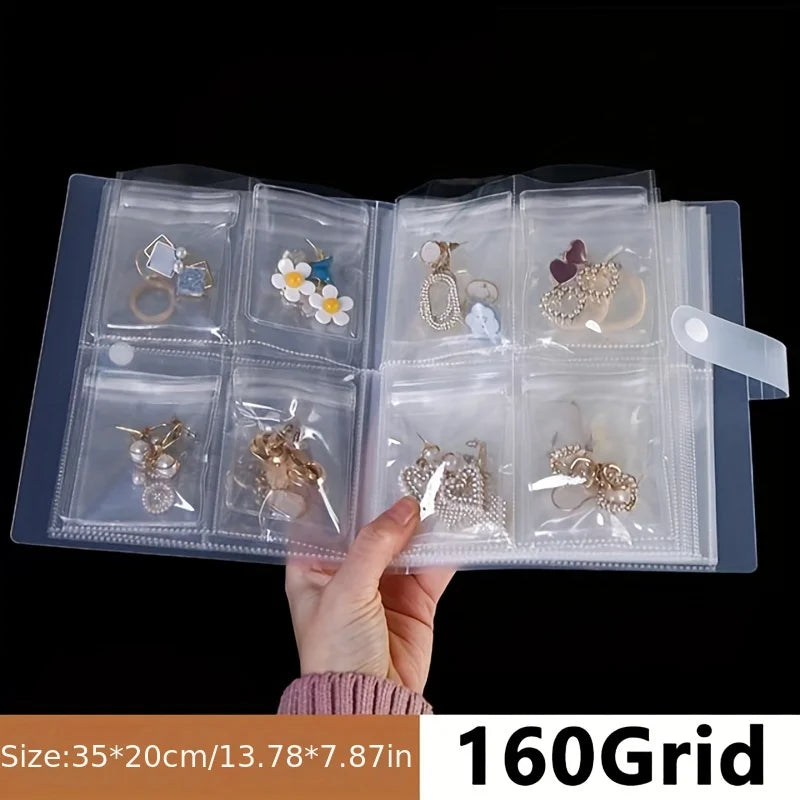 Transparent jewelry organizer storage bags with various earrings and rings displayed in a grid format