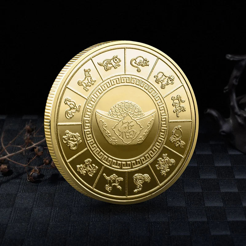 A round gold collectible coin featuring various mythical creatures and a central dragon design.