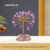 A crystal tree made of amethyst stones, featuring natural color variations and small cracks.