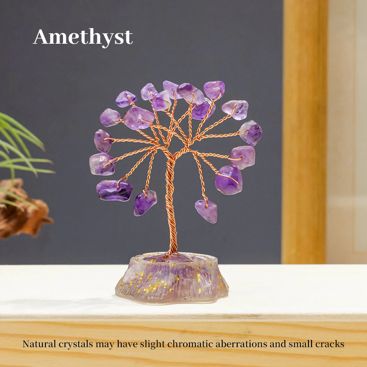 A crystal tree made of amethyst stones, featuring natural color variations and small cracks.