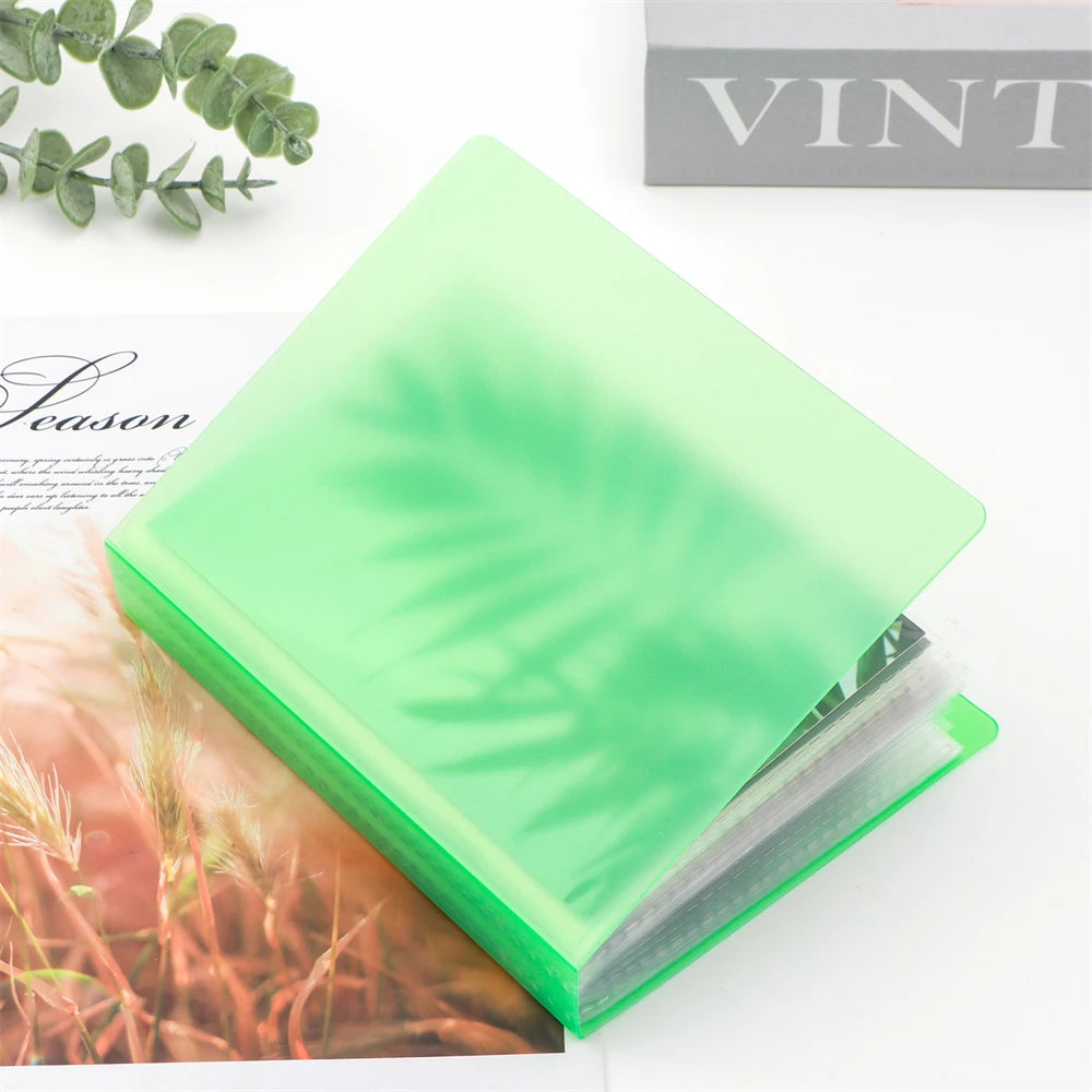 A clear A6 storage album with 40 pages for stickers, photos, and craft supplies shown on a white surface.