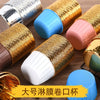 A collection of golden greaseproof cupcake liners in various colors, including gold, pink, blue, and white.