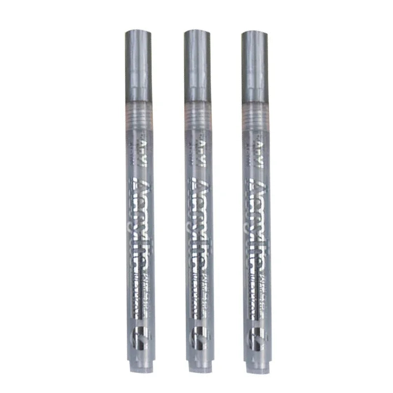 Three clear acrylic paint pens with fine tips are displayed vertically.
