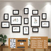 A collection of 13 photo frames in black and white featuring various designs for wall display.