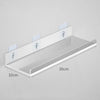 Clear acrylic floating shelf with wall mounts, measuring 30cm long and 10cm deep.